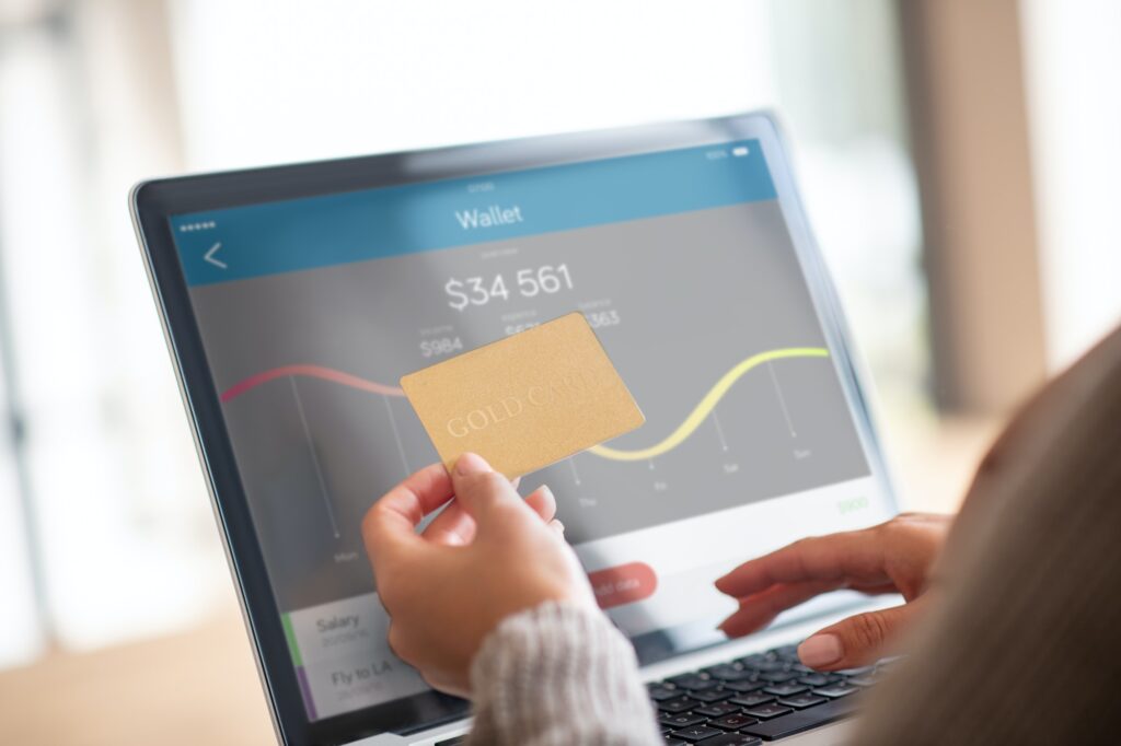 Close up of woman checking balance of bank account online || E-Commerce Sales Dropping in UAE
