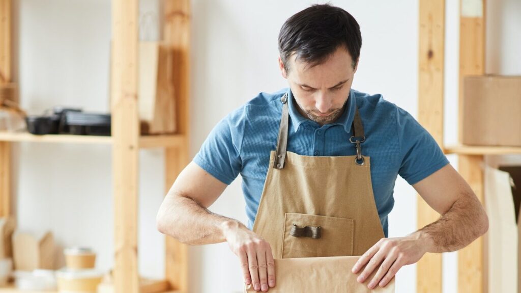 Man Packaging Orders at Food Delivery