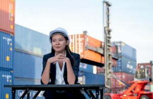China to Amazon FBA in UAE, Portrait of engineer worker of factory technician with Chinese woman style sit in cargo area