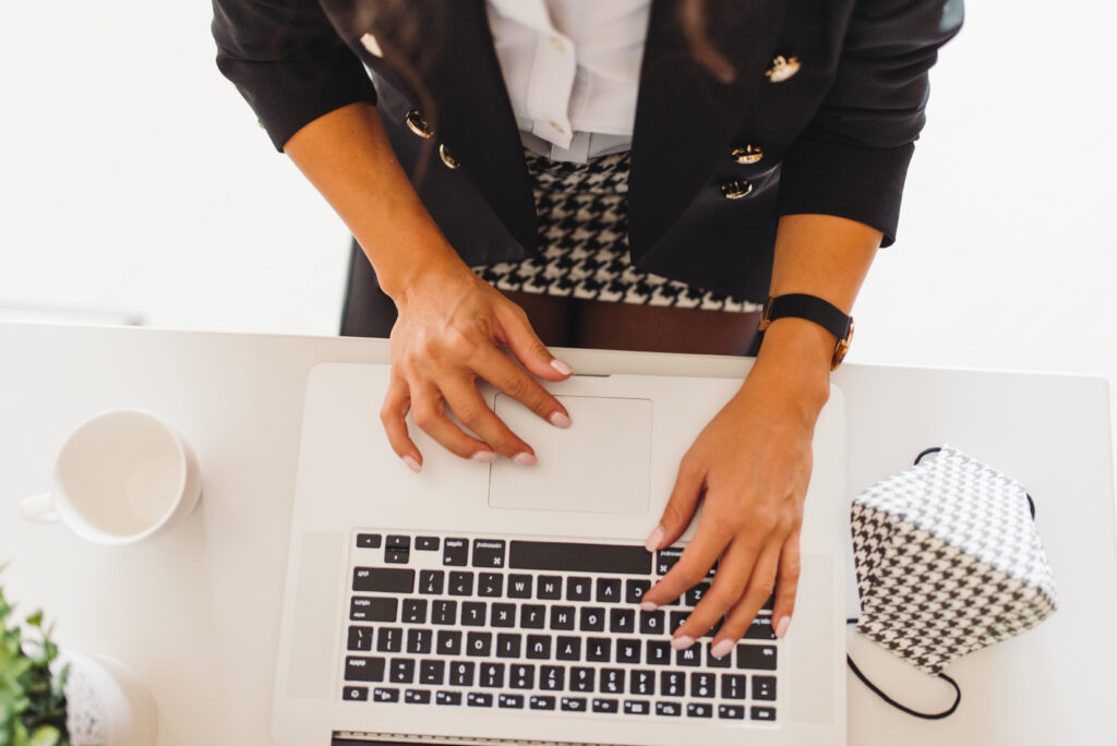 Business woman working on laptop.