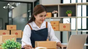 Receptionist preparing set a number of packages to be dispatched for delivery - in-house vs remote fulfilment UAE - by GHSL Fulfilment Centre